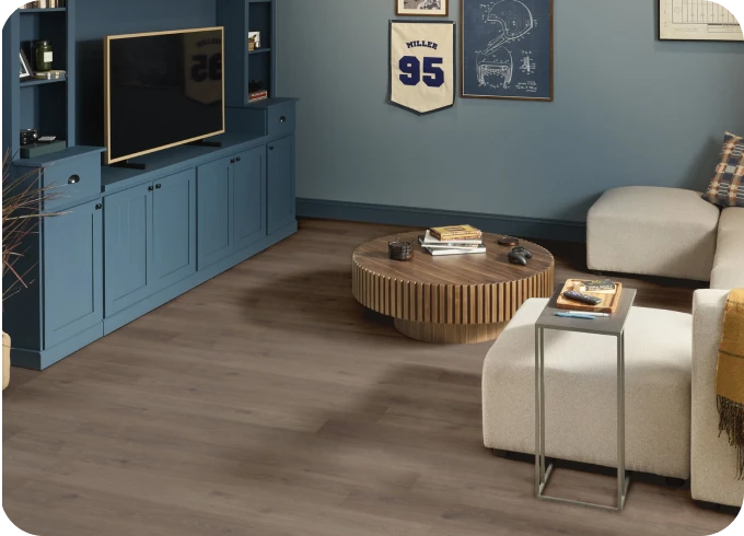 Laminate flooring in sports themed living room | Lloyd's Carpets & Draperies