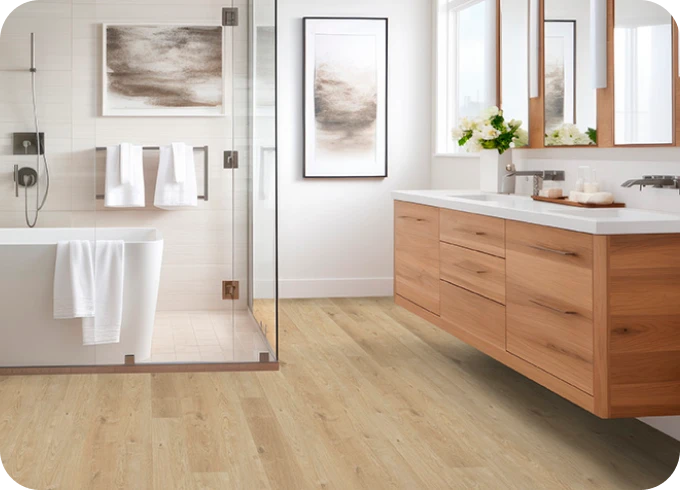 Luxury Vinyl in white modern bathroom with glass shower | Lloyd's Carpets & Draperies