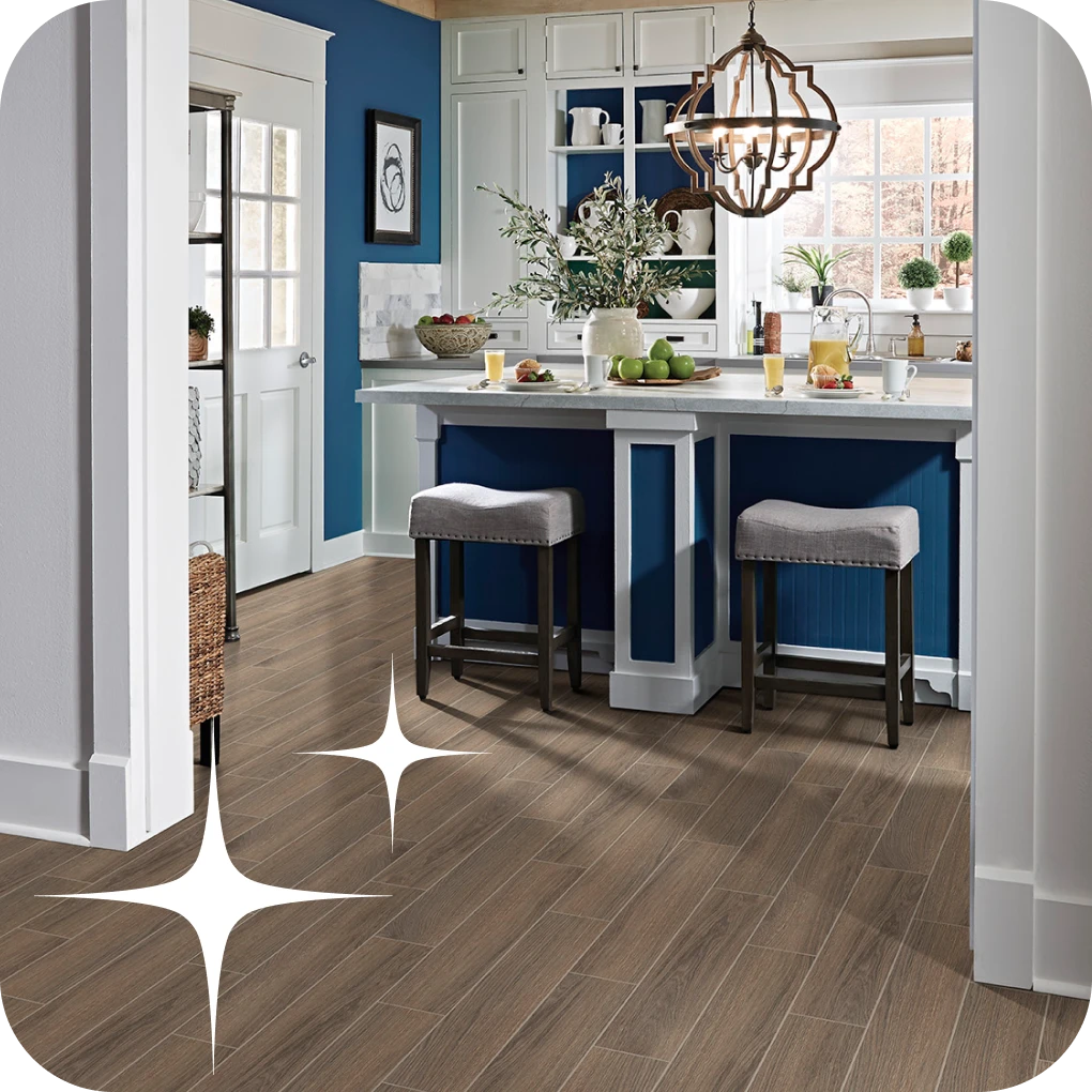 Wood look tile flooring in kitchen with blue cabinets | Lloyd's Carpets & Draperies