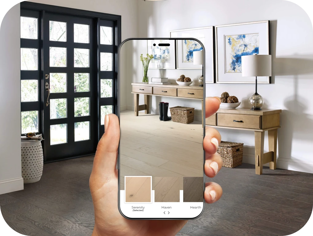 Person using cellphone room visualizer to view a new floor in their space | Lloyd's Carpets & Draperies
