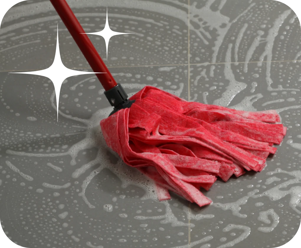 Close-up of mop on wet tile flooring | Lloyd's Carpets & Draperies