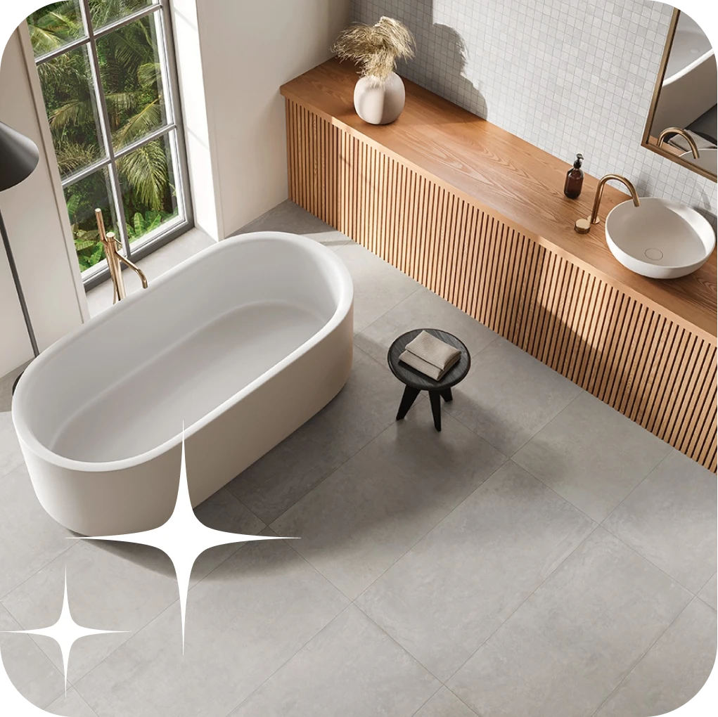 Stone tiles in overhead view of modern bathroom with rounded tub | Lloyd's Carpets & Draperies