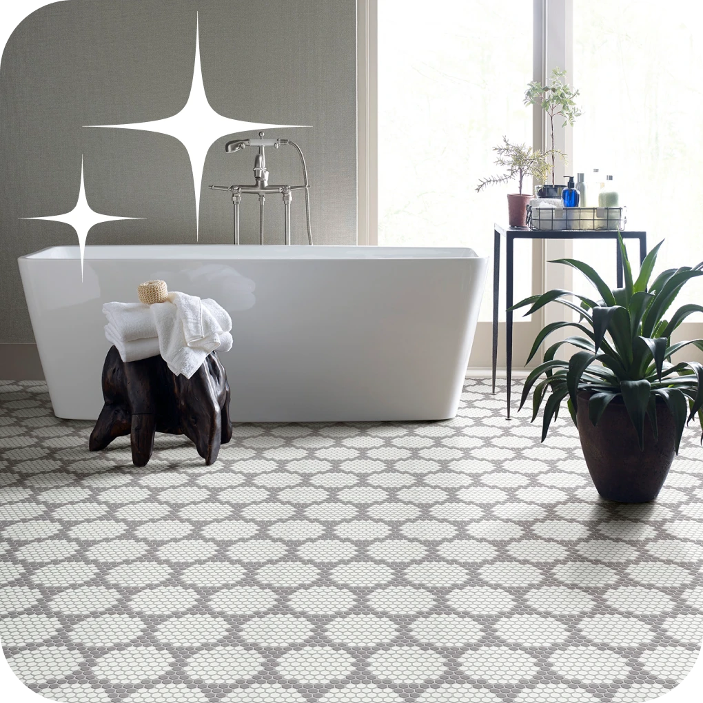 Patterned tile in bathroom with large free-standing tub | Lloyd's Carpets & Draperies